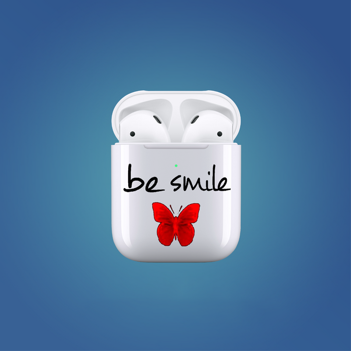 White wireless earbud case with 'be smile' text and red butterfly on a blue background