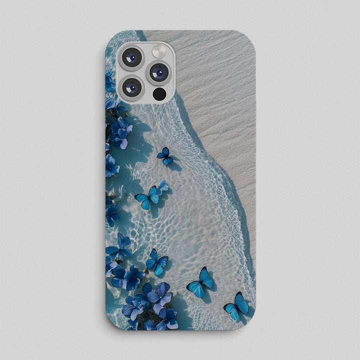 Phone case with blue butterfly design on a beach background