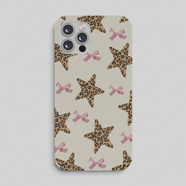 Phone case with leopard print stars and pink bows on a beige background