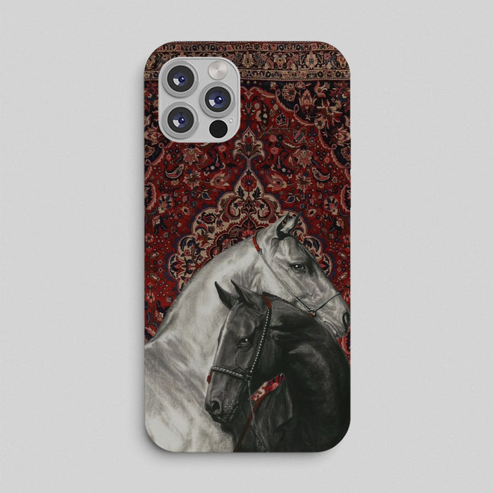 Royal Equinox Phone Case with black and white horses on a red Persian rug