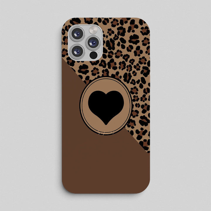 Phone case with leopard print and heart design on a gray background
