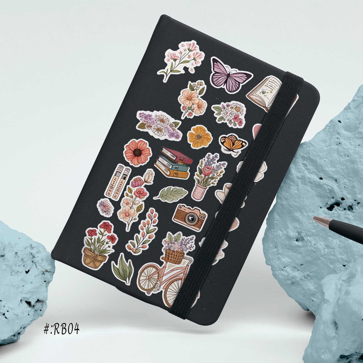 Hardcover notebook with black cover decorated in floral, butterfly, book, and coffee stickers for a cozy aesthetic
bunny store